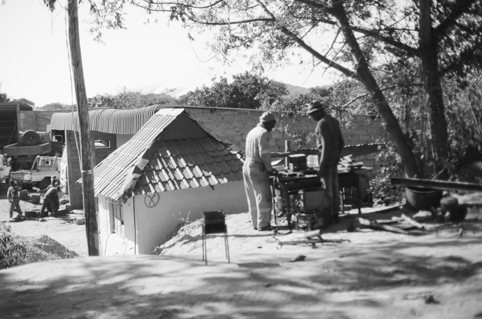 People working together in an outdoor workshop setting